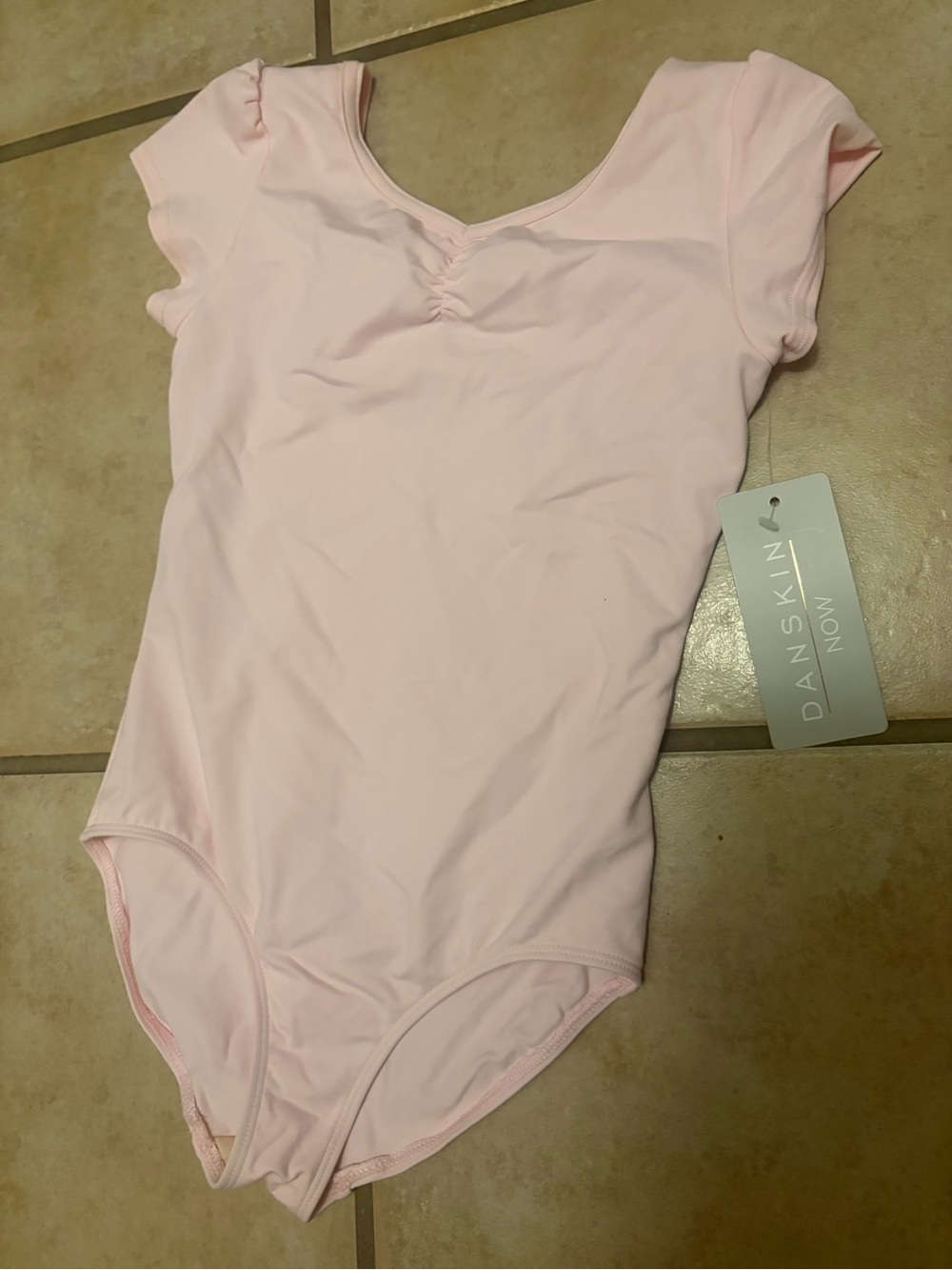 Girl pale pink danskin cap sleeve leotard